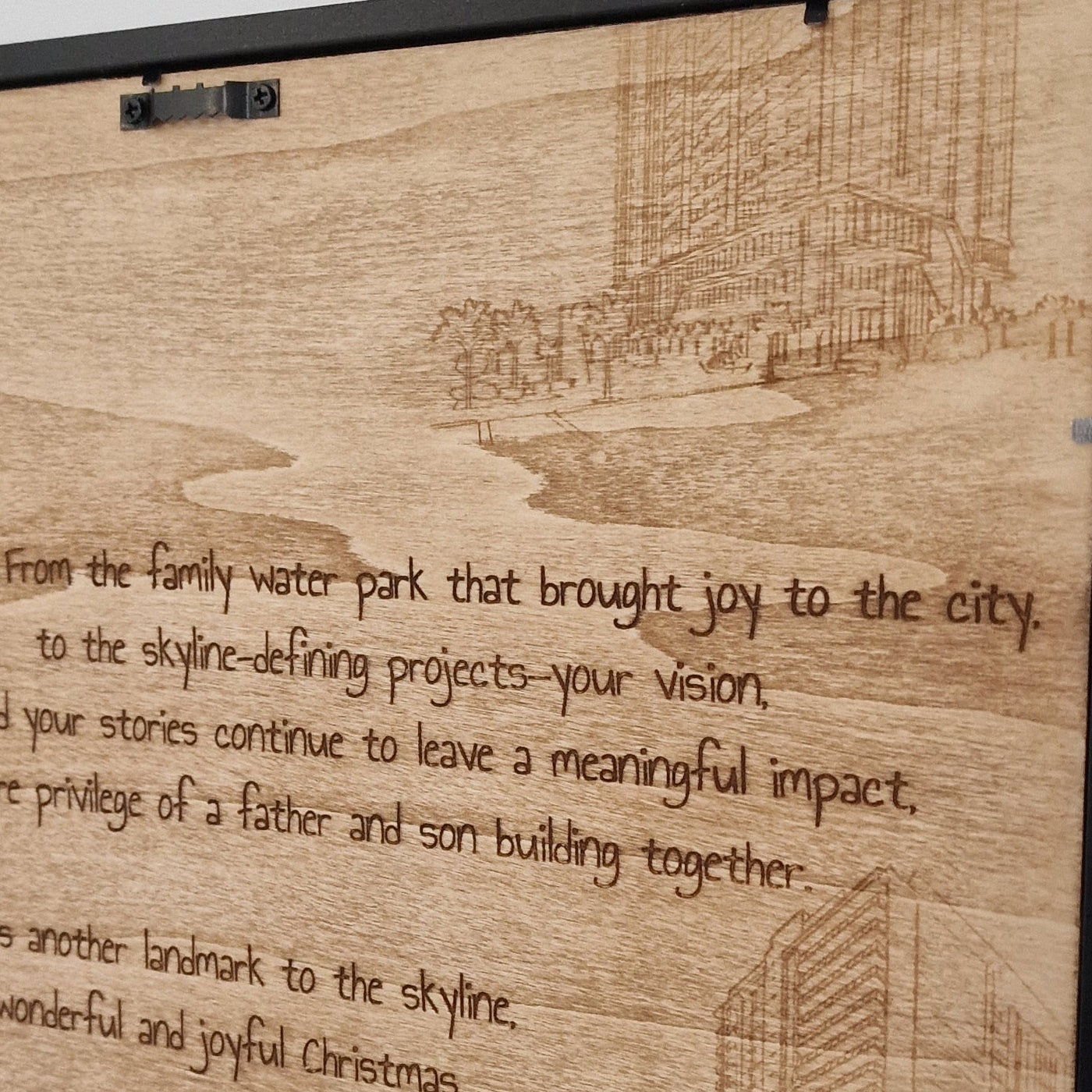 Wooden plaque with engraved text on a white background